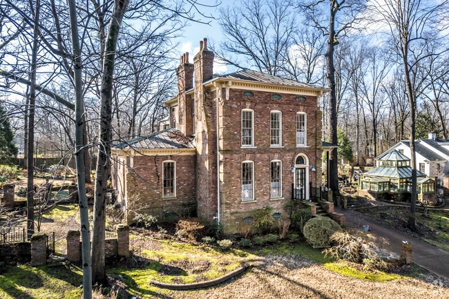 Large single-family home with a greenhouse in the Colonial Acres neighborhood.