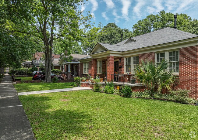 A row of brick ranches and green gardens in Cottontown.