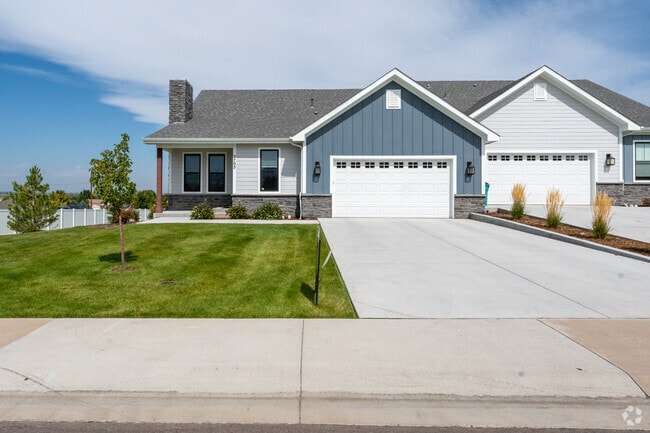 The neighborhood has new builds with freshly manicured lawns scattered through out the area.