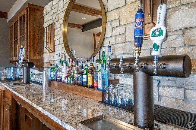 Enjoy a relaxing drink at TPC Country Club's clubhouse in Sherman Village after a game of golf.