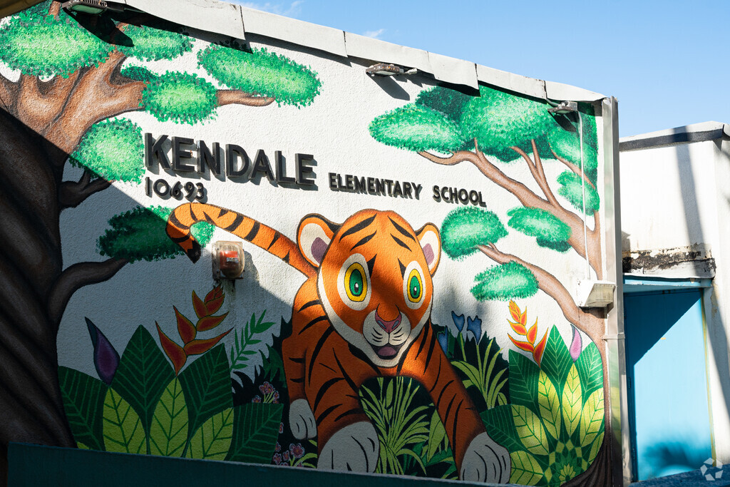 A playful tiger mural at the entrance of Kendale Elementary School.