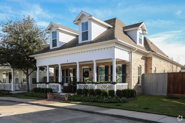 A Cape Cod home with a large porch found in the Five Oaks area.