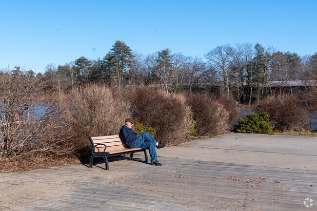 A man sits on a bench in Nara Park, enjoying the sun in Acton.