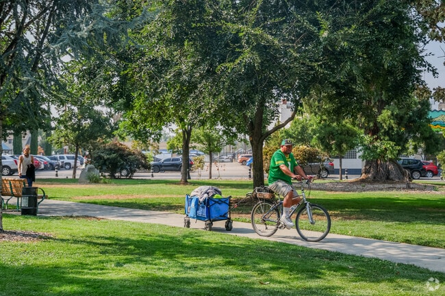 Alba Park has bikers passing through in Medford.