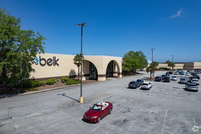 There is a mall with large retailers near Country Club Estates.