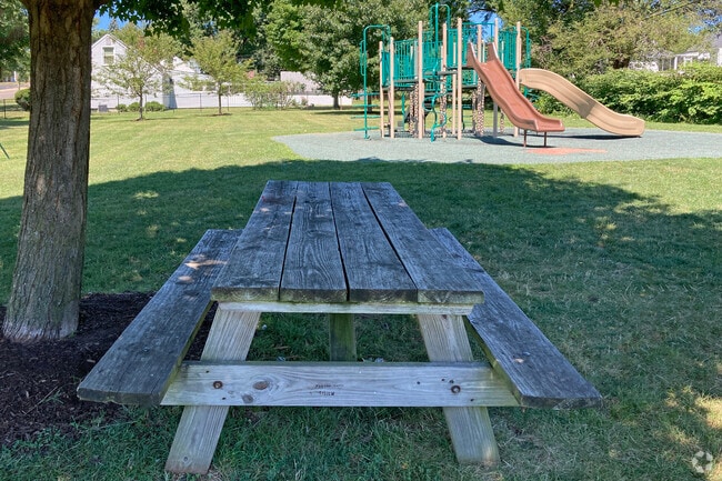 A picnic area in Lawrence Park is near the playground in Harter Heights.