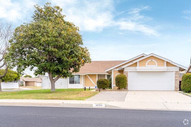 A stunning ranch home with front-facing brick in Hendrick Ranch, blending timeless style with cozy charm, adds a warm touch to the neighborhood.