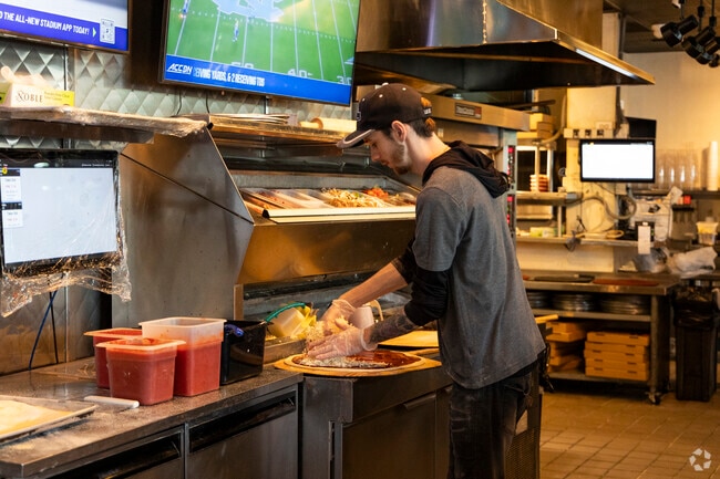 Wood-fired pizza is the highlight at Tortora’s, a local favorite in Hampton Cove.