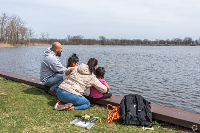 A family fishes at Sand Pond in North Dunes Nature Preserve near Beulah Park.