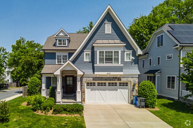 Charming Traditional home, located in the W Chevy Chase Heights neighborhood, features unique architectural details and an attached two-car garage.