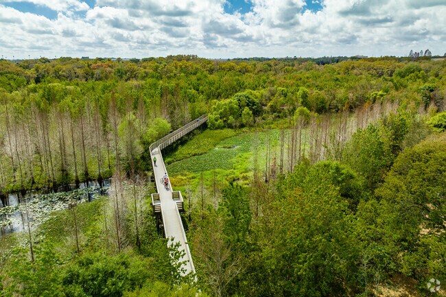 Brigadoon of Clearwater residents enjoy strolls along the wooden boardwalk in Kapok Park.