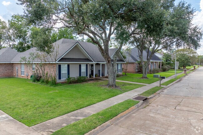 Trees line the sidewalks of several residences in Hunters Grove.