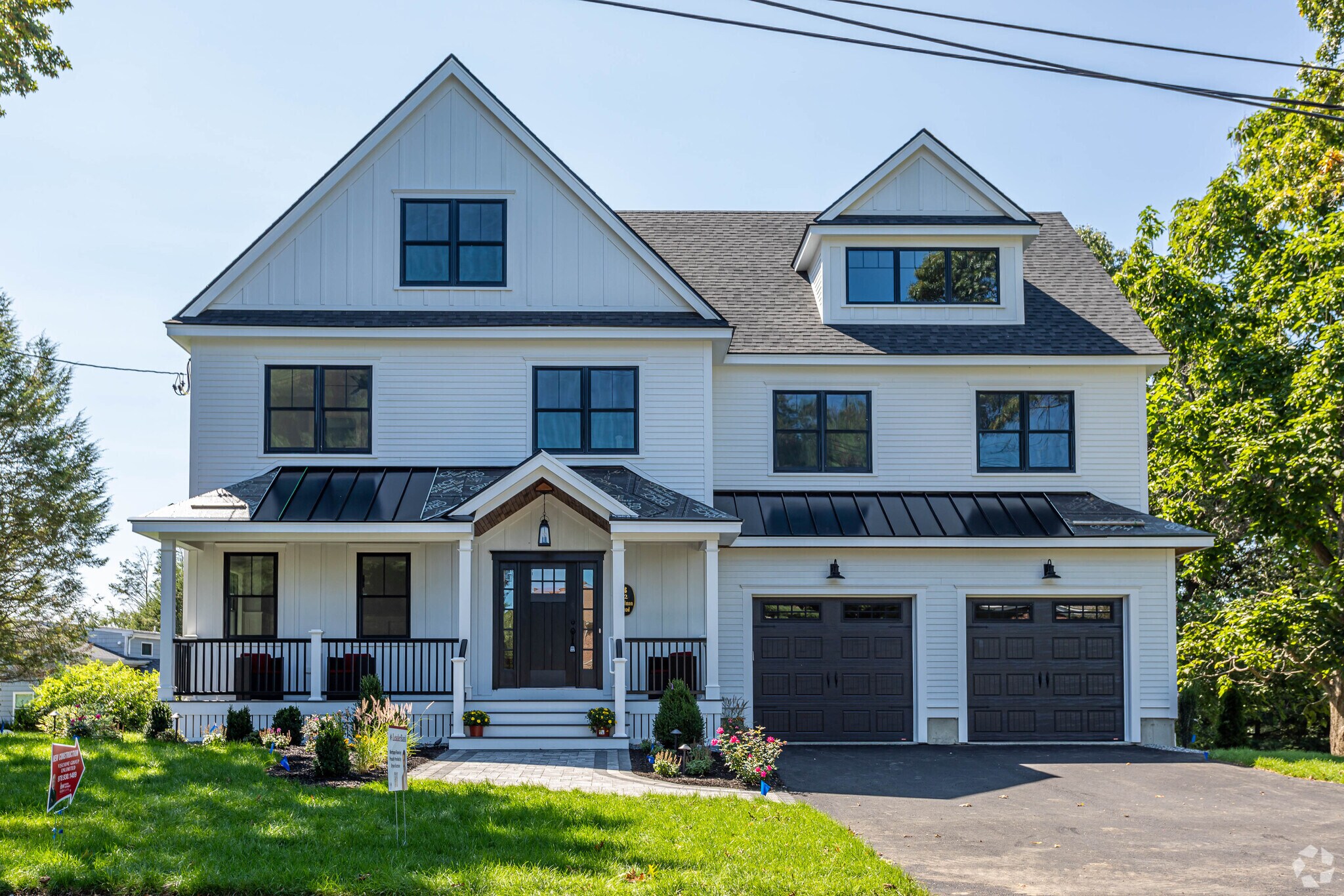 Contemporary colonial with double garage in Woodhaven.