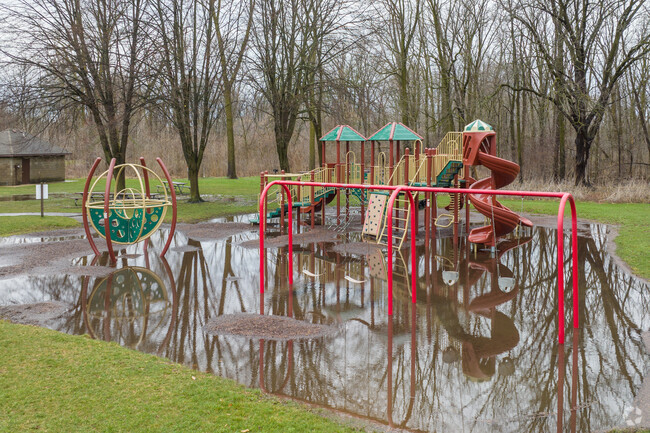 Playground equipment sits right next to the parking lot for Creekside Park.