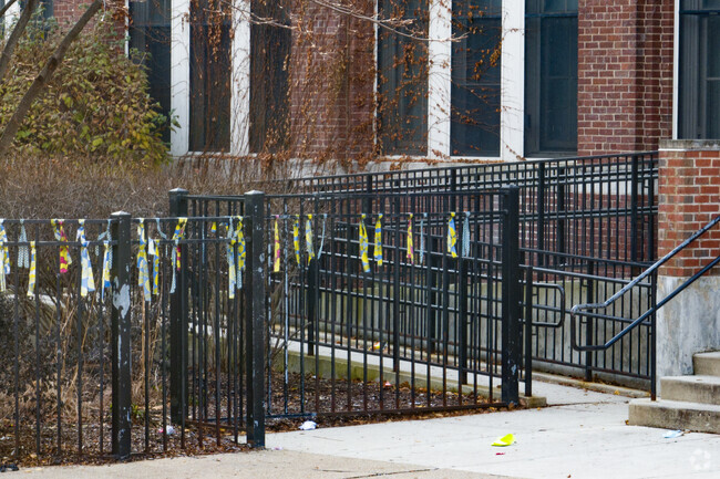 The fences at Manierre Elementary School are decorated with student ribbons.
