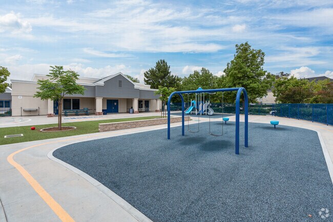 A padded playground and swing set keep children active at Bridgeport Elementary School.