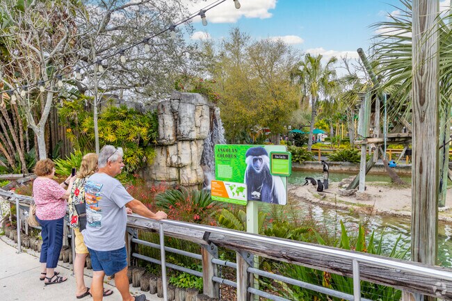 Informational signage teaches visitors about the animals at Zoo Tampa near Riverbend.
