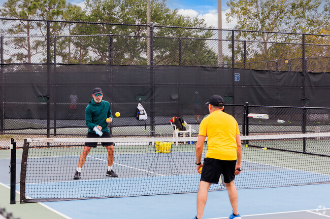 Competitive spirit shines at a pickleball game in Ranchette.