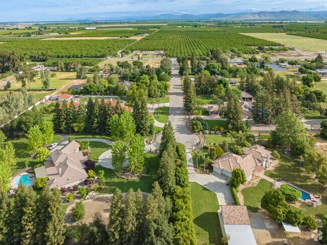 Find suburban homes nestled in between orange orchards and the foothills of Tulare County.
