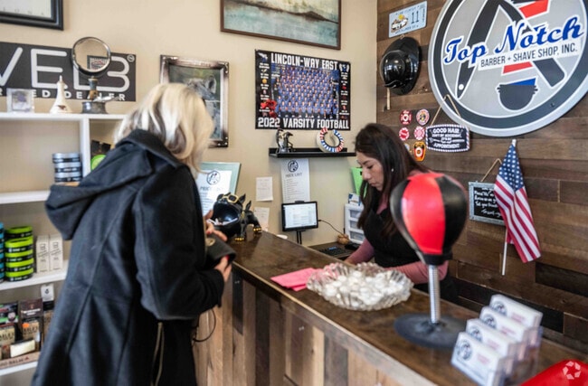 Customers like the great haircuts they get at the Top-Notch Barber Shop in Prestwick.
