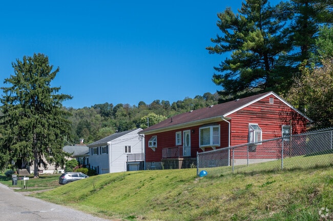 Homes in Bellaire line up along the street with modest front yards.