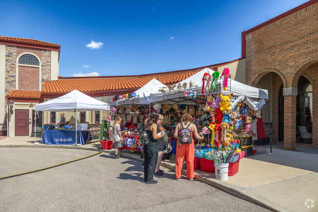 Fest-goers explore vendor tables at the St. Sophia's Greek Fest.