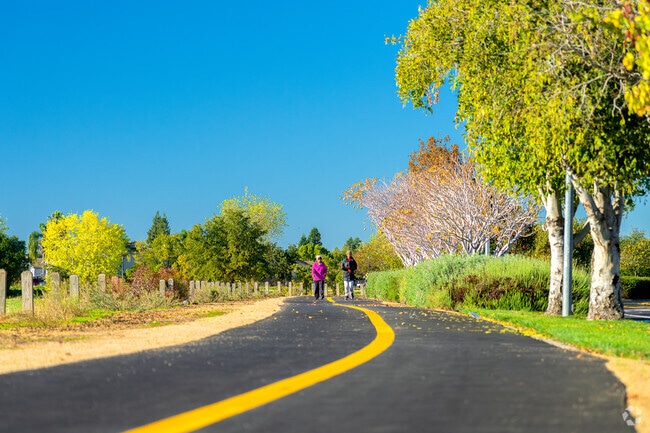 Smoothly paved bike paths follow a nature preserve on the North side of North West Elk Grove.