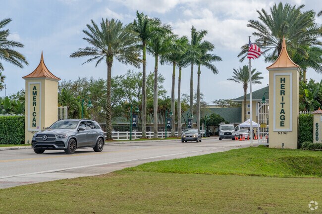 Enjoying the serene surroundings of American Academy, Palm Beach Campus, amidst lush greenery.