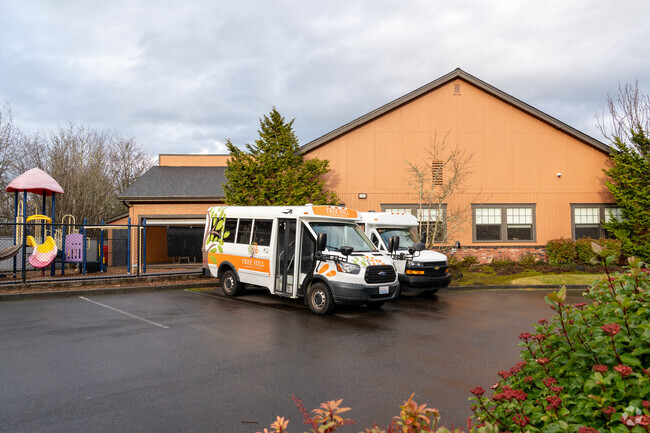 Back exterior and playground of Tree Hill Learning Center.