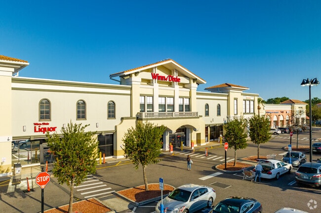 Buy local groceries at the Winn Dixie  in the Temple Terrace neighborhood.