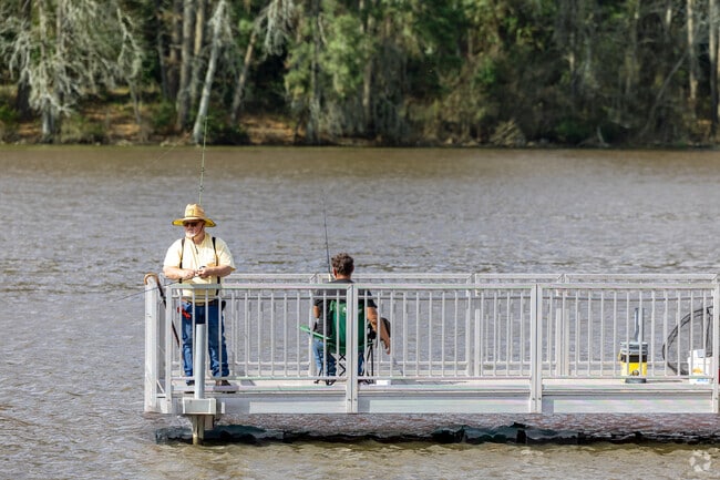 Anglers gather at the pier to reel in their next big catch at Ellen Trout Park near Liberty.