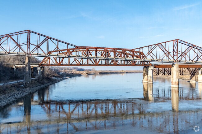 Plattsmouth can be found east of the Missouri River from Iowa.