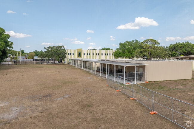 A fence on the west side of Dr. Phillips Elementary keeps children within boundaries .