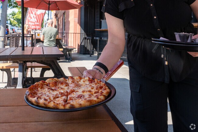 Enjoy pizza from Brick House, a restaurant in downtown Vancouver, only a five minute drive away.