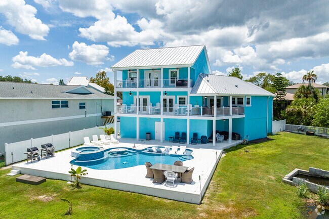 Multi-level pool home on the Cotee River in New Port Richey South.