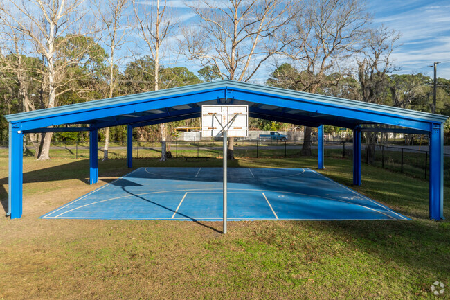 Students enjoy the covered basketball court at James A Webster Elementary School.