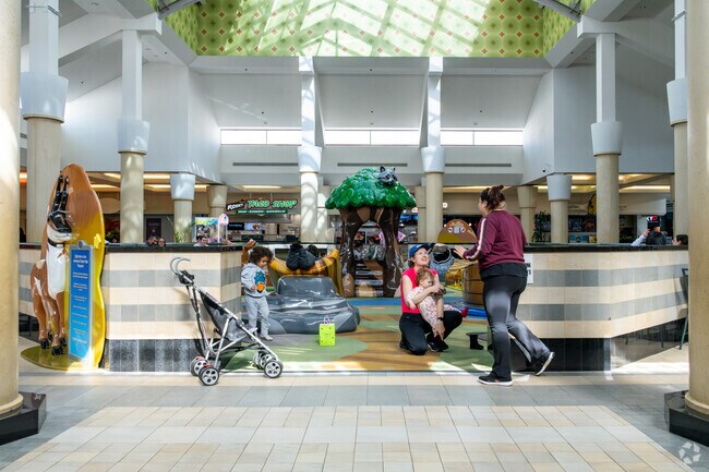 Kids play while parents relax at the playground in Northwest Palmdale’s Antelope Valley Mall.