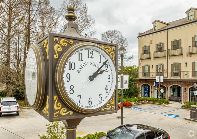 A large clock bring historic charm to the center of Bayou Square in the Timberlane.