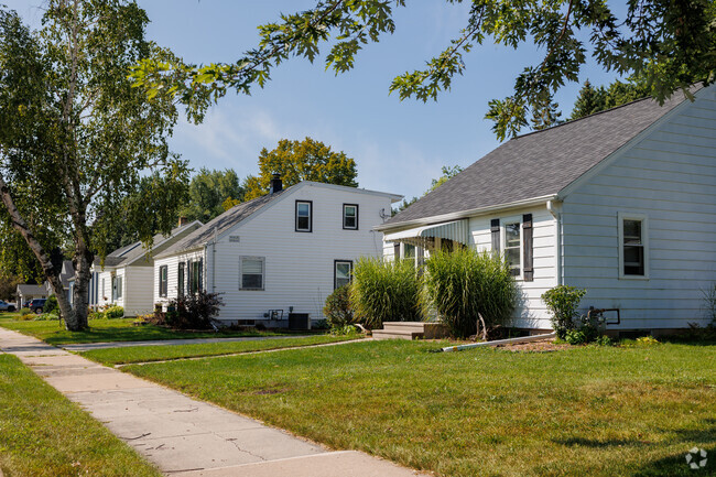A variety of bungalows and two-story homes fill out a neighborhood street in Huntley Houses.