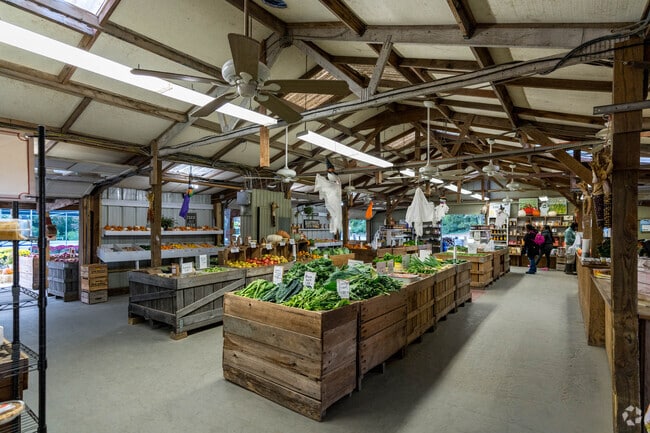 Locals pick up fresh produce at Spicknall's Farmers Market in Konterra.