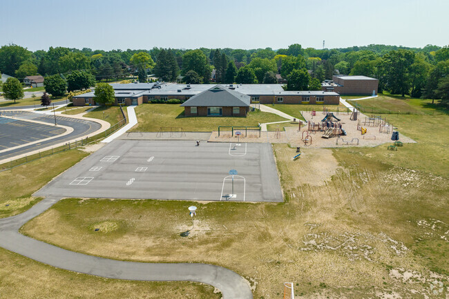 Rear aerial view of Loon Lake Elementary School, basketball courts, and playground.