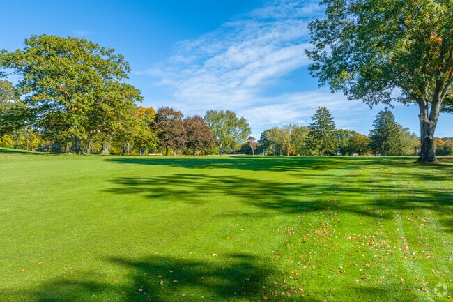 Leaves gently fall on the 15th fairway at Potowomut Golf Club.