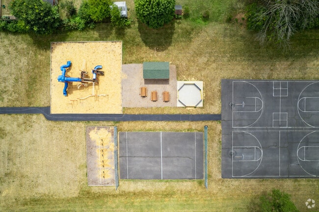 The Christian School Of Grace Baptist Church has a large play area behind the building.