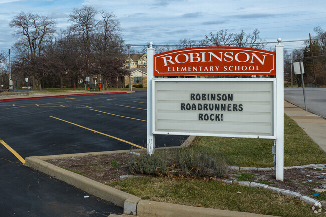 The entrance sign at George R. Robinson Elementary School welcomes kids to school.