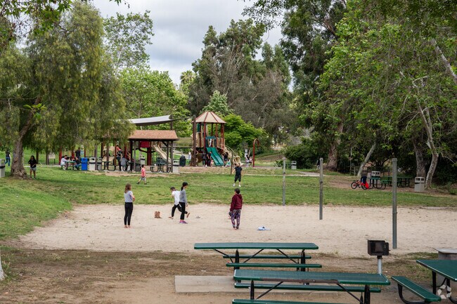Kids flock to the playground at Brengle Terrace Park in Vista.
