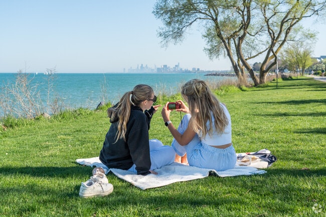 Students admire the skyline views from the Evanston waterfront at Northwestern.