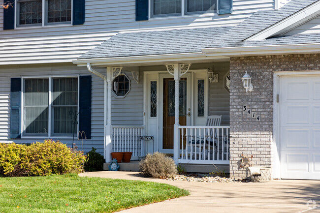 Some properties in Walton Hills feature smaller porches with enough room for a seating area.