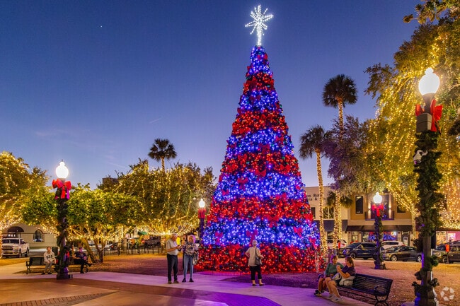 The amazing Christmas tree at Santa on the Square in Ocala shines brightly against the sky.