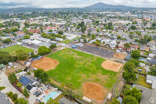 There are multiple baseball fields on the grounds of Lemon Avenue Elementary School.