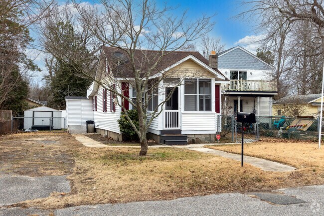 This ranch house was built in the 1920's and has a driveway for parking.